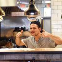 <p>Tinari works in the kitchen at Bing&#x27;s Burgers in Fort Lee.</p>