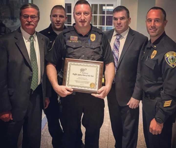 Fairfield Officer Mark Letsch, center, is surrounded by (left to right): Deputy Chief Chris Lyddy, Sgt Mike Paris, Chief Gary MacNamara and Lt. Robert Kalamaras.