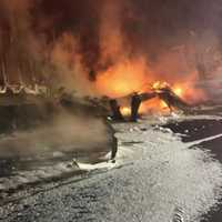 <p>Debris from a fiery crash early Saturday involving two tractor-trailers just past Exit 16 on eastbound on I-84 in Southbury.</p>