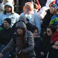 <p>Parade fans bundled up against the cold winds.</p>