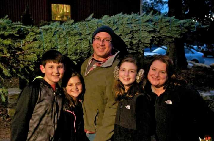 A family getting their tree at Jones Family Farms in Shelton, Conn.