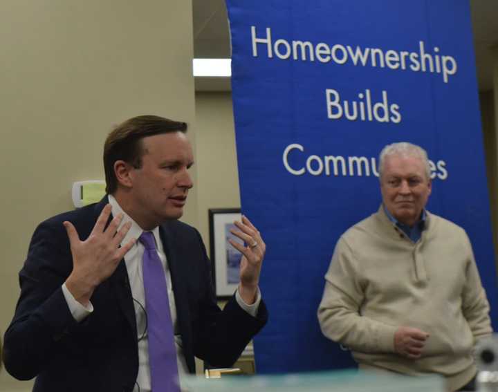 U.S. Sen. Chris Murphy, left, and Fairfield First Selectman Mike Tetreau discuss new federal tax law with real estate agents and homeowners in Fairfield Friday.