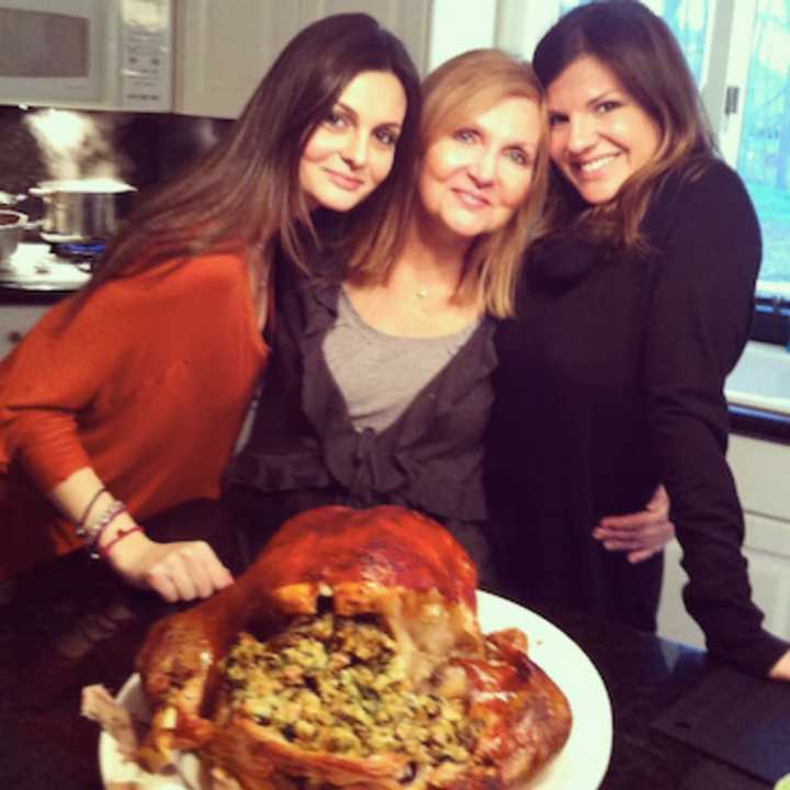 Norwood Chef Tara Ippolito-Lafontant, right, with friends, cooking up a dish.