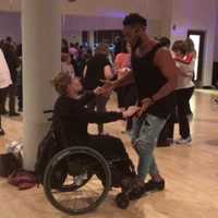 <p>Rashad Jennings dances with Amanda Trott at HackensackUMC Fitness and Wellness Center in Maywood.</p>