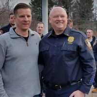 <p>Retired Yorktown police Officer John Hassett, left, with Yorktown Police Chief Robert Noble. Hassett stepped down after 30 years of service to the law enforcement community this week.</p>