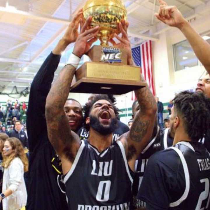 Joel Hernandez of Teaneck celebrates after shocking Wagner last week to win the NEC title.