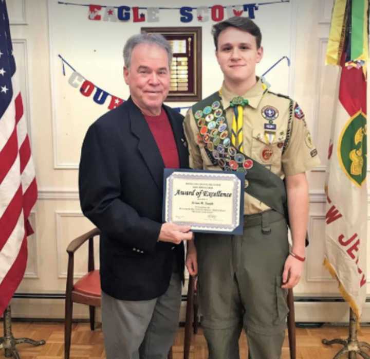 Rockland County Executive Ed Day congratulates new Eagle Scout Brian Smith of Sloatsburg.