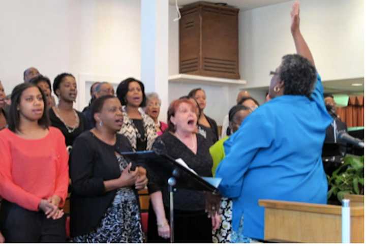 Earlena Thevenin-Green leading the Antioch Baptist Church Choir.