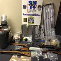 <p>Drugs and weapons seized as part of a Connecticut State Police raid assisted by Homeland Security agents and local police.</p>