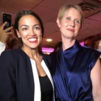 <p>“Who Is Alexandria Ocasio-Cortez?&quot; On the left, she celebrated her Democratic Party upset win over U.S. Rep. Joe Crowley. Fans of TV&#x27;s &quot;Sex And The City&quot; might recognize the woman on the right: Cynthia Nixon. Now, AOC is a West Coast &#x27;&quot;rising star.&quot;</p>