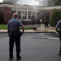 <p>Firefighters are working to determine the cause of a fire that heavily damaged at least one classroom on the first floor of a Ridgewood elementary school on Wednesday morning.</p>