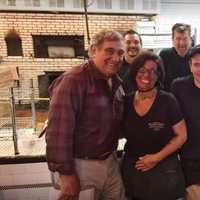 <p>Dan Lauria poses with staffers at Frank Pepe&#x27;s Pizzeria in New Haven earlier this month.</p>