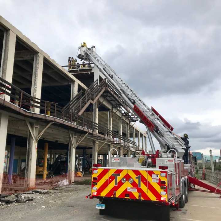 First responders helped rescue a worker who was injured during demolition efforts at 860 Canal St. in Stamford.