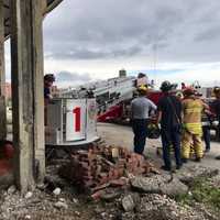 <p>First responders helped rescue a worker who was injured during demolition efforts at 860 Canal St. in Stamford.</p>