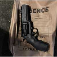 <p>The gun used during the robberies.</p>