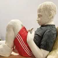 <p>Alt used modeling chocolate to sculpt the boy.</p>