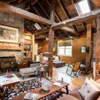 <p>The entire home features hewn beams from a barn in Canada.</p>