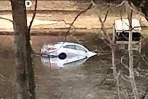 Rolling Car Strikes Woman, 88, Lands In Lake