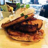 <p>“The Hungry Girl” Pork Bacon Burger on Pancakes with Poached Egg!</p>