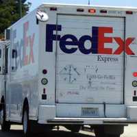 <p>A FedEx employee who had her truck stolen in Hackensack clung to its side door for 20 feet before  police located the suspected thief a few streets away, authorities said.</p>