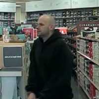 <p>Police investigators in Suffolk County have released photos of a man and his minivan after he allegedly stole a pair of sneakers from a store in Shirley.</p>