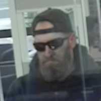 <p>Police in Suffolk County are looking for an alleged bank robber who took an undisclosed amount of cash from an Apple Bank in Lindenhurst.</p>