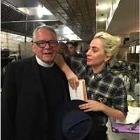 <p>Father John Duffell and Lady Gaga</p>