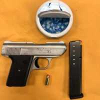 <p>Gun and drugs seized during the arrest.</p>