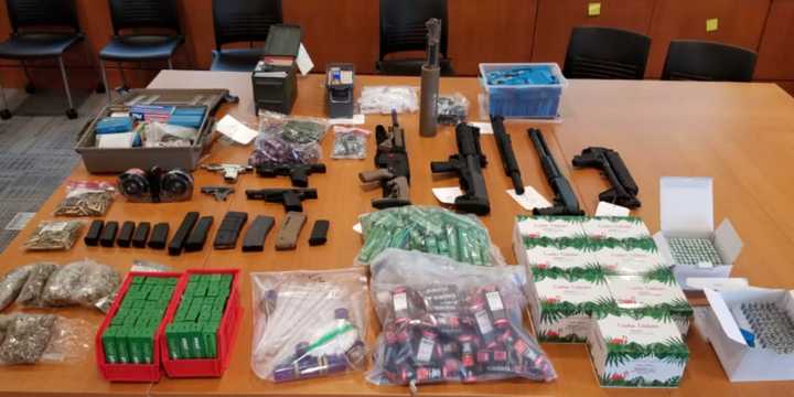 Troopers seized cocaine, marijuana, drug paraphernalia and illegal firearms, including handguns and assault rifles, in a warrant search.