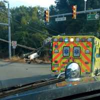 <p>An overturned car knocked down a utility pole, closing Route 15 in Jefferson Thursday.</p>