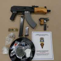 <p>Drugs and weapons seized during the bust.</p>