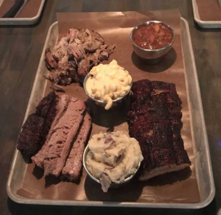 Old Fields Barbecue, located at 15 New Street in Huntington, serves smoked, savory proteins like beef brisket, pulled pork, smoked chicken, ribs, pork sausage and pulled chicken.