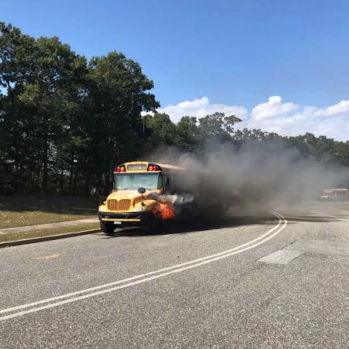 A school bus caught fire on its way to pick up students in Moriches.