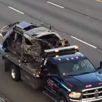 <p>A car from the crash towed away</p>