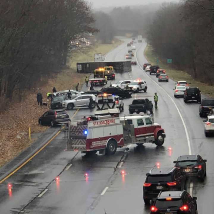 A tractor trailer overturned and several cars behind it crashed Sunday in Warren County.