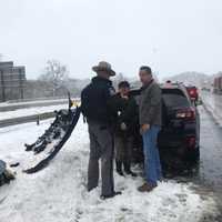 <p>Governor Cuomo helps motorists involved in a crash after enacting a state of emergency.</p>