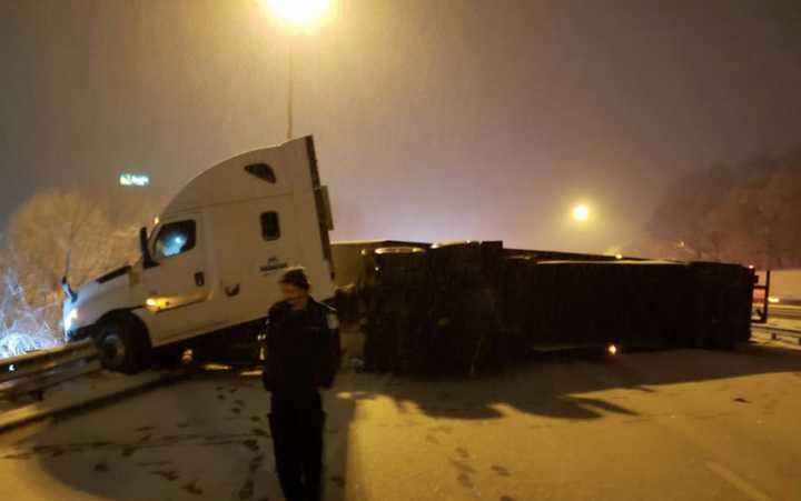 An overturned tractor trailer blocked all lanes of Route 80, backing traffic up all morning on the eastbound side.