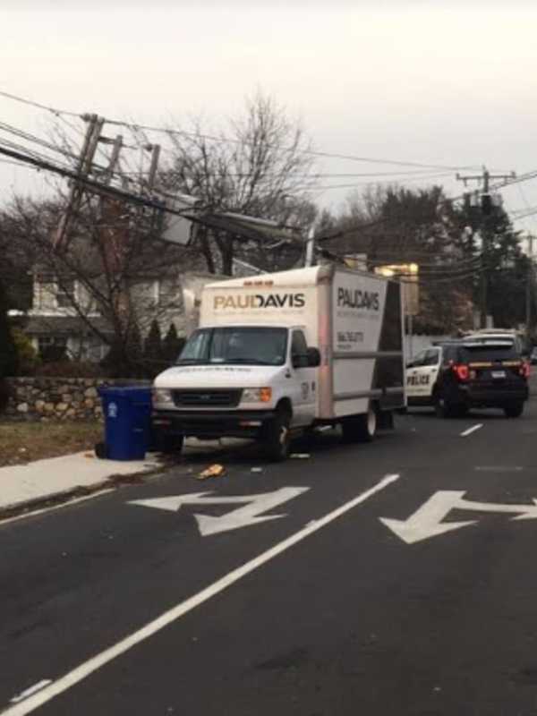 Box Truck Crashes Into Telephone Pole, Splitting It In Half, In Norwalk