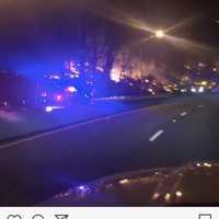 <p>A Route 80 motorist captures pockets of fire on Mount Tammany Sunday night.</p>