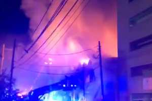 Businesses, Apartments Become Engulfed In Flames In Four-Alarm Long Island Fire