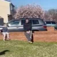 <p>A Hamilton police officer delivering birthday gifts to Quinn.</p>