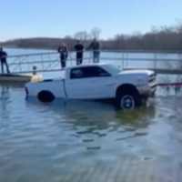 <p>Emergency crews helped tow a pickup truck out of a Howell reservoir.</p>