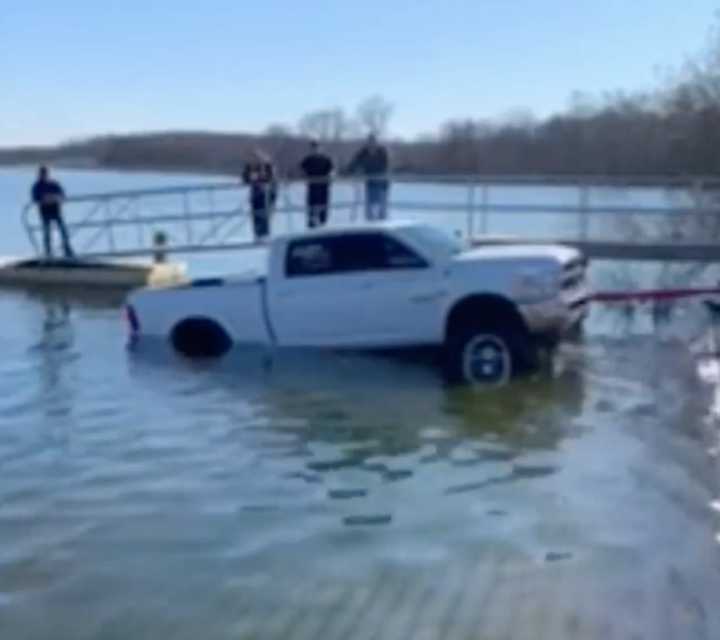 Emergency crews helped tow a pickup truck out of a Howell reservoir.