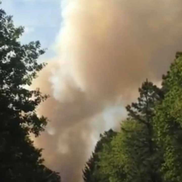 A brush fire consumed nearly 100 acres in the Whiting section of Manchester. This view is from Harry Wright Boulevard.