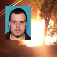 <p>Jonathan Davies, 26, was arrested following an investigation into the early-morning Wednesday blaze, authorities said Thursday.</p>