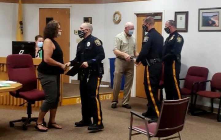 Officer Michael Citarelli, Officer Thomas Hill and Detective Michael Camerata of Mansfield Township Police were presented with the award at the Mansfield Township Committee Meeting on August 13.