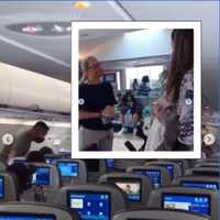 <p>Chaya Bruck argues with a JetBlue official (inset) after she and her fellow passengers were ousted from their Newark-bound plane Wednesday.</p>