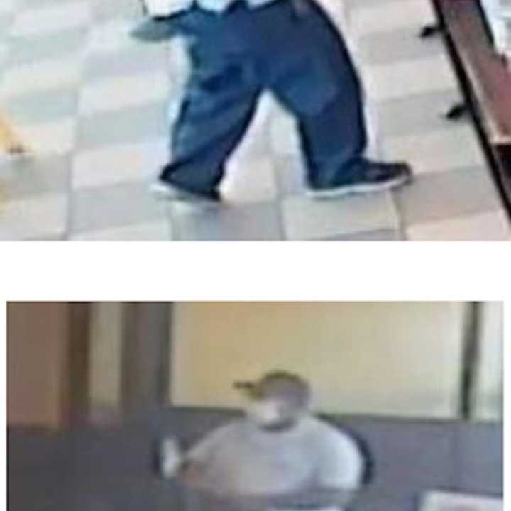 Police have released photos of a suspect who is at large after an armed robbery at a Long Island Dunkin’ Donuts.