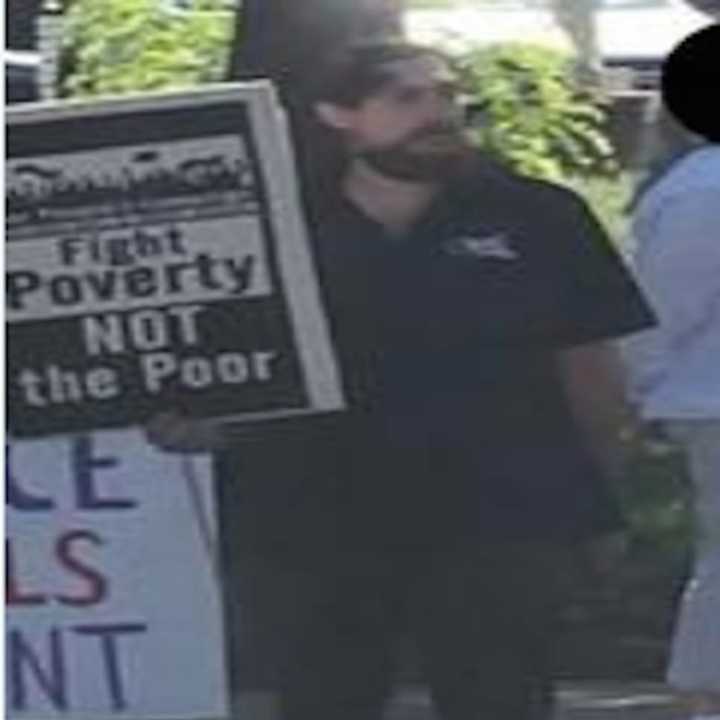 A photo of the wanted man who pushed a 64-year-old man from the opposing group at a rally.