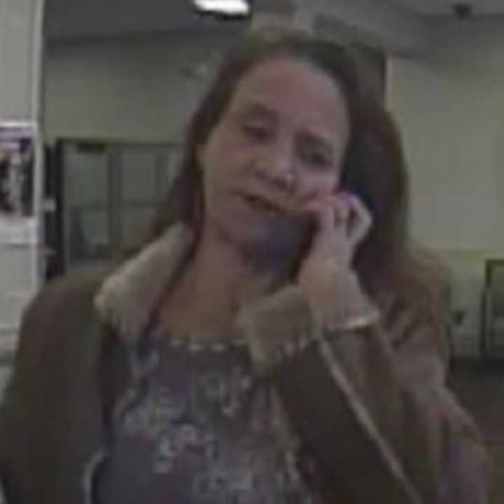 A woman is wanted in Dutchess County after stealing thousands of dollars using a fraudulent check.